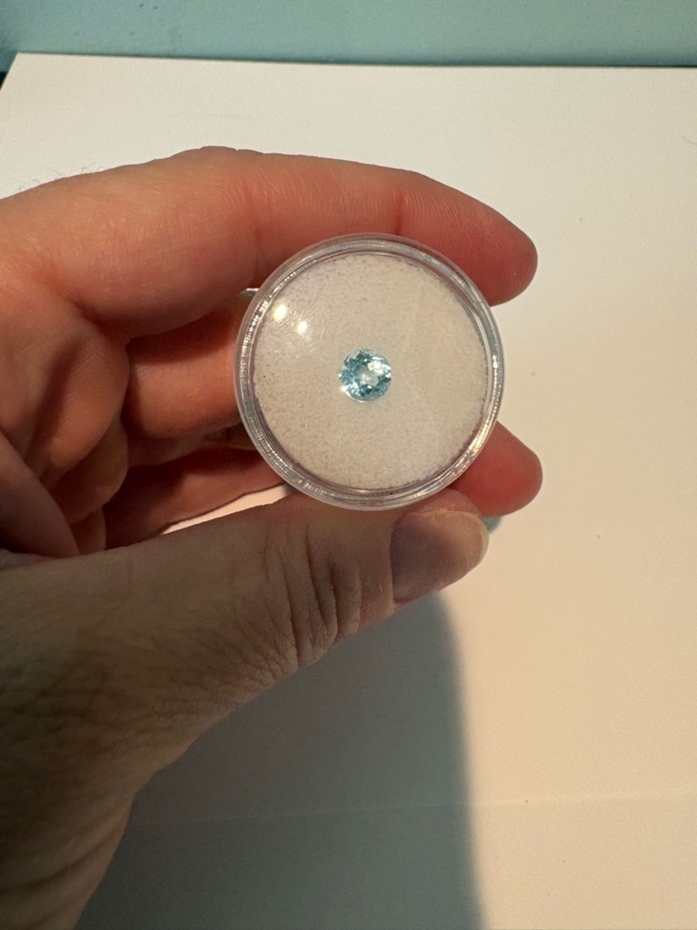 Round Light Blue natural Topaz 1Ctw in Display Case.